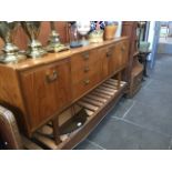 A mid 20th century retro teak sideboard. Catalogue only, live bidding available via our website.