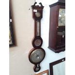 A barometer. Catalogue only, live bidding available via our website. If you require P&P please