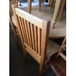 A light oak round dining table and four high back chairs Catalogue only, live bidding available