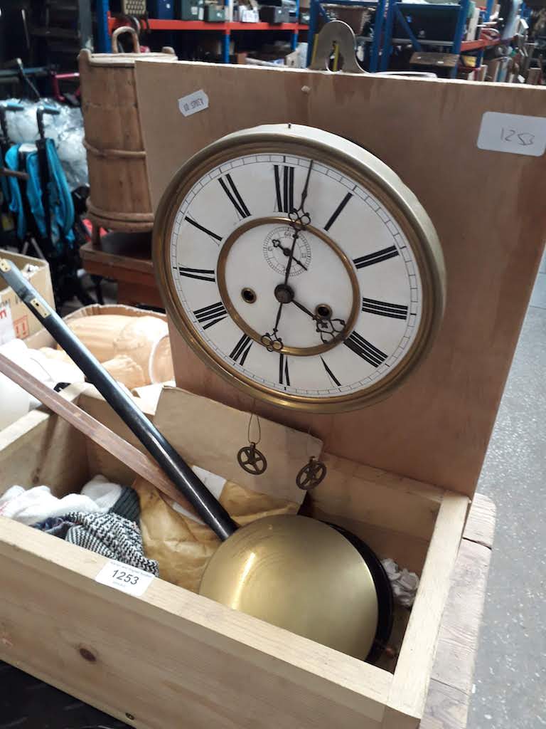 A quantity of clock parts including a movement Catalogue only, live bidding available via our