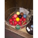 A complete set of snooker balls and wire basket Catalogue only, live bidding available via our