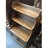 An Ercol waterfall bookcase. Catalogue only, live bidding available via our website. If you