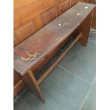 An early 20th century oak bench. Catalogue only, live bidding available via our website. If you