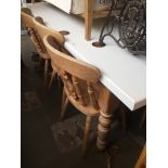 A large pine country kitchen table with single drawer and white compostie top together with 8