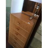 A mid century tall light oak chest of drawers with mirror top Catalogue only, live bidding available