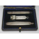 A hallmarked silver cigar accessories set.