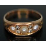 A Victorian diamond and pearl ring cluster ring, band unmarked, gross wt. 3.36g, size P.