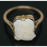 A ring set with a rectangular opal cabochon, band indistinctly marked '9ct', gross wt. 2.09g, size
