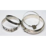 Two hallmarked silver bangles and two others marked 'Silver'.