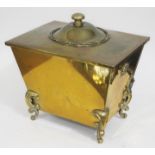 A brass coal box with twin handles and scroll feet, height 40cm.