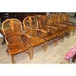 A set of six reproduction Windsor chairs with crinoline stretchers.