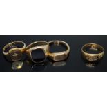 A group of four rings comprising three hallmarked 9ct gold, wt. 11.74g, and a hallmarked 18ct gold