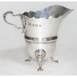 A hallmarked silver cream jug, wt. 3oz.