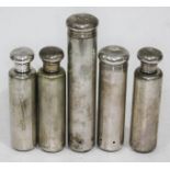 A group of five hallmarked silver topper bottles.