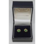 A pair of diamond and emerald cluster ear studs, the cluster measuring approx. 9mm x 7mm, Portuguese