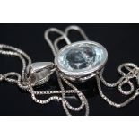 An aquamarine pendant, the bezel set oval cut stone meauring approx. 19mm x 10mm x 6mm, both pendant