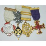 A hallmarked silver gilt Masonic type medal and three others.