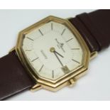 A gents hallmarked 18ct gold Baume & Mercier quartz wristwatch with leather strap, tank style case
