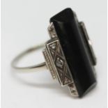 An Art Deco diamond and black onyx ring, band unmarked, gross wt. 5.20g, size P.