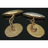 A cased pair of cufflinks, one marked '18ct 9ct&PT', no engravings, wt. 7.12g.