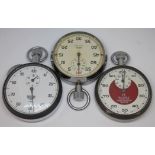 Three stopwatches comprising an Omega 'Prestons Timer Division Bolton', an Heuer and a Smiths.