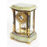 A French late 19th century champlevé enamel, gilt brass and onyx four glass clock, serpentine front,