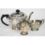 A three piece hallmarked silver tea service, gross wt. 30oz.