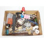 A box of bric a brac including pipes, a cut throat razor, treen, metalware etc.