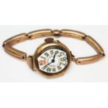 A ladies Art Deco style wristwatch with stylised numerals, marked '14k' and strap marked '9ct',