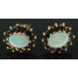 A pair of hallmarked 9ct gold precious opal and sapphire cluster earrings, setting measuring approx.