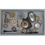 A tin box with clocks and parts, a 9ct gold ladies watch, sovereign case, medals, etc.