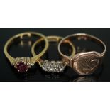 A group of three rings comprising a hallmarked 18ct gold diamond and glass filled ruby cluster, a