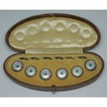 A cased Art Deco Sterling Silver button set.