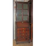 A provincial early 18th century and later oak bureau bookcase of small proportions, the top with six