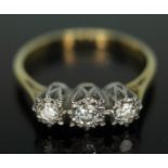 A hallmarked 18ct gold three stone diamond ring, gross wt. 2.81g, size L.