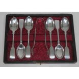 A matched set of hallmarked silver spoons and sugar tongs.