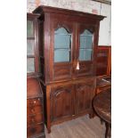 A French 19th century oak kitchen cabinet with glazed top, the interior with shaped shelves above