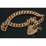 A link bracelet with heart shaped clasp, marked '9', wt. 9.02g.