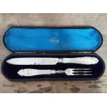 A cased silver knife and fork with mother of pearl handles, Chawner & Co, London 1876.