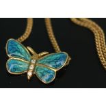 A modern Arts & Crafts style hallmarked 18ct gold enamel and diamond set butterfly pendant on