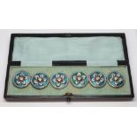 A cased set of six Arts & Crafts enamelled silver buttons, William Hair Haseler, Birmingham 1909,