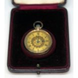 A ladies pocket watch with gilt dial and Roman numerals, the outer case marked '9k' to the inside,