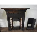 A Victorian cast iron Adams style fireplace.