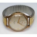 A 1950s Smiths De Luxe hallmarked 9ct gold wristwatch with champagne signed dial, Arabic numerals,
