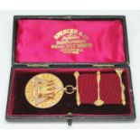 A hallmarked 9ct gold Masonic medal, gross wt. 24.80g (with ribbon), with case.