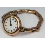 An early 20th century ladies 9ct gold wristwatch with sprung strap marked '9ct', having Roman