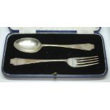 A cased hallmarked silver fork and spoon.