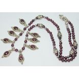 A purple garnet cabochon and bead necklace, hallmarked silver, length 40cm.