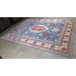 A large eastern carpet 297cm x 420cm.