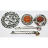 A mixed lot of Scottish brooches comprising one featuring a rampant lion within Celtic style